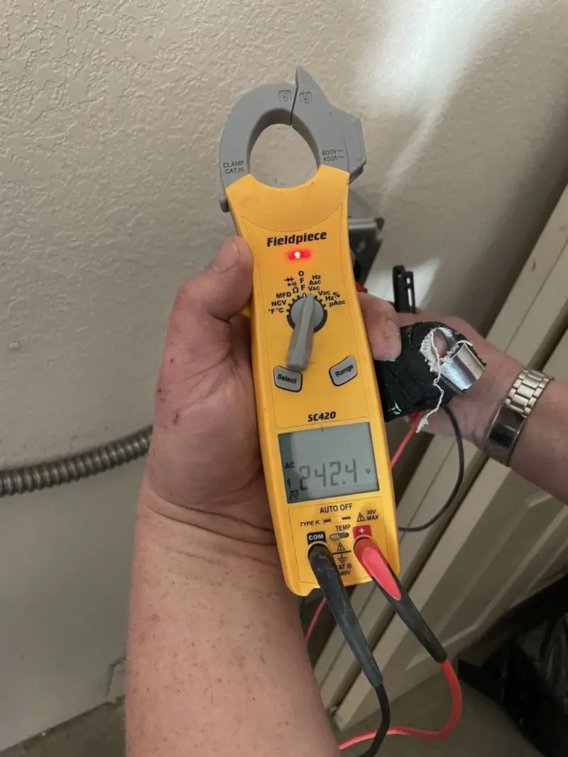 Voltage testing with clamp meter during Electrical Installation Services in Independent Hill